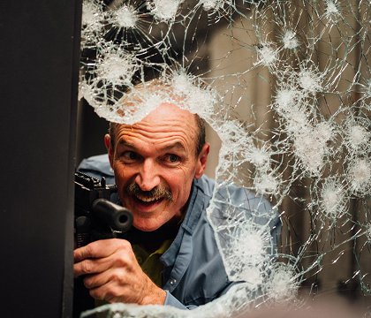 V obležení